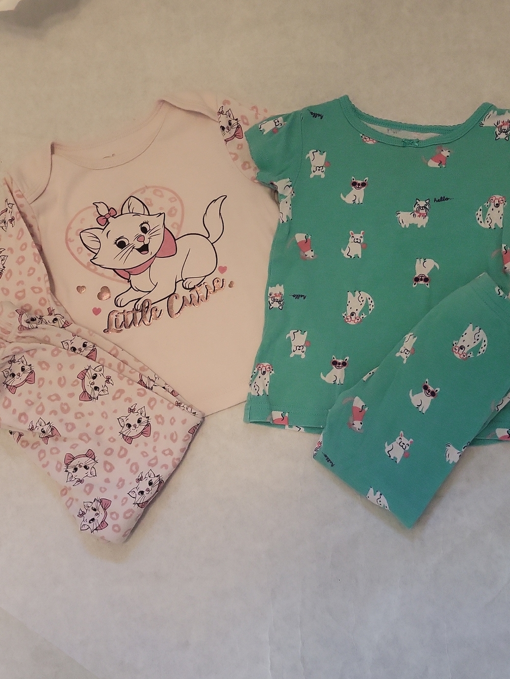 Two pair of girl's pajamas